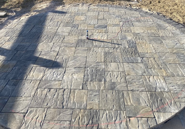 Circular Textured  Blue moon stone patio with a gas line for incoming fire pit
