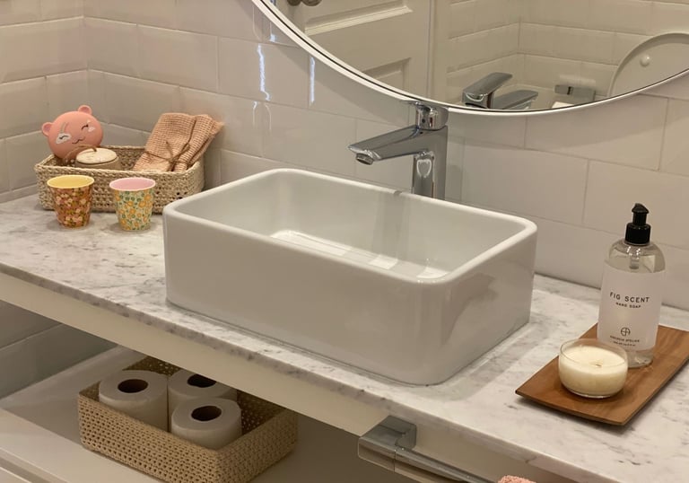 a bathroom sink with a mirror and a mirror