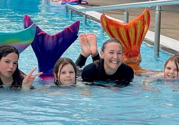 Kids learning to swim like a mermaid