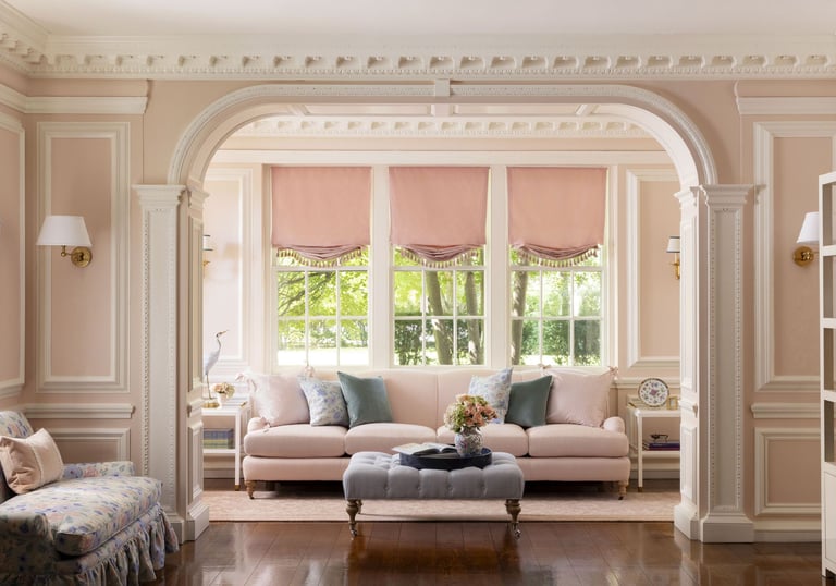 a living room with a couch and a ottoman
