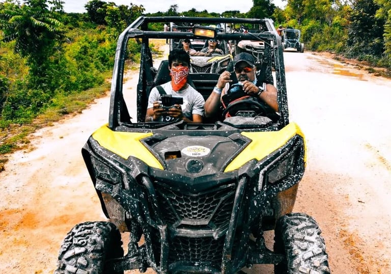 a group of people riding in a buggy adventura punta cana