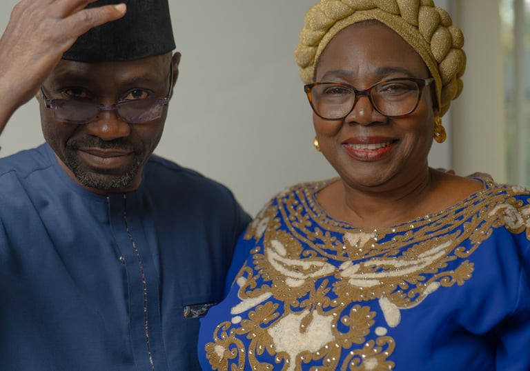 Older Nigerian couple dressed in elegant traditional attire, cultural portraits 