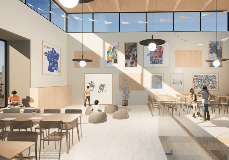 espace d'activité avec des tables et un espace jeux avec un tableau blanc