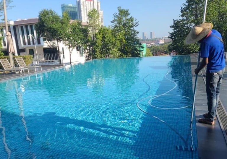 Crystal-clear swimming pool cleaning by TOT Cleaning & Landscape Sdn Bhd.