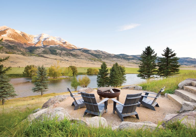 a fire pit with chairs and a fire pit