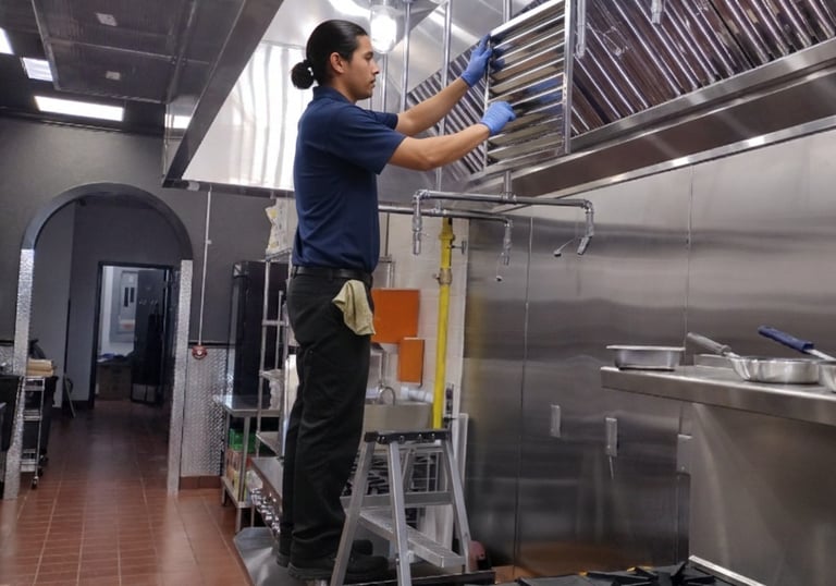 a man is installing a hood filter