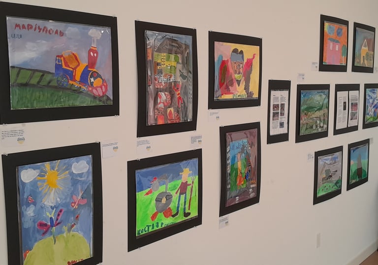 Display showing Ukrainian kids paintings in VALA