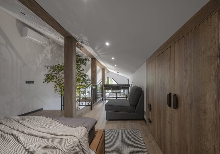 a bedroom with a bed and a couch