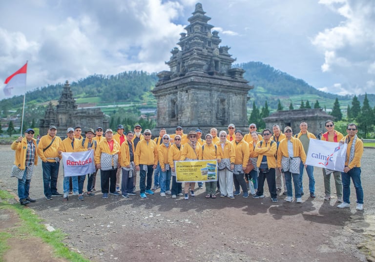 a group of people in yellow shirts and yellow shirts