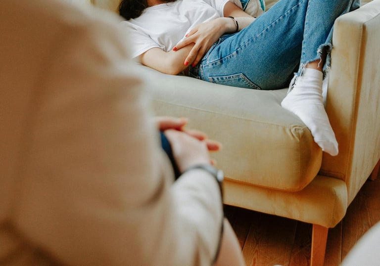 a woman sitting on a couch in a living room