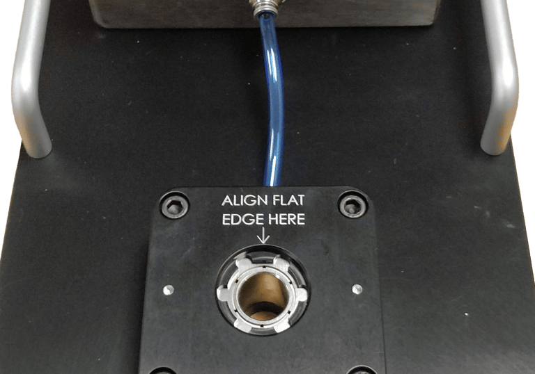 Vacuum metrology fixture for holding a soft rubber medical dome