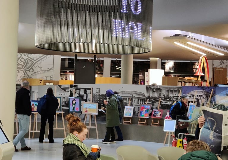 People looking at the artwork