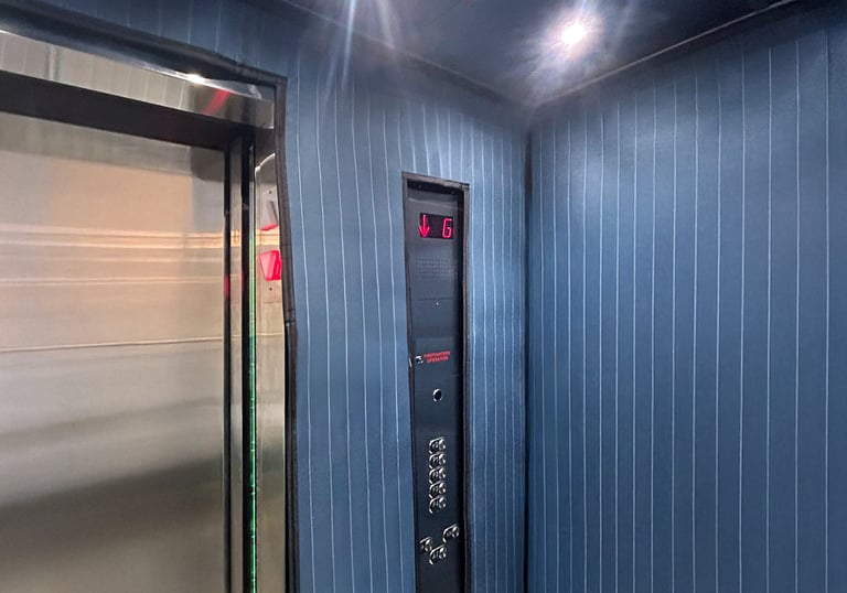 elevator interior with protection pads installed to protect the elevator during moving times