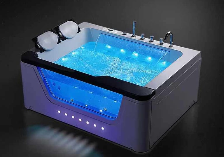 a bathtub with a blue led light and a blue light