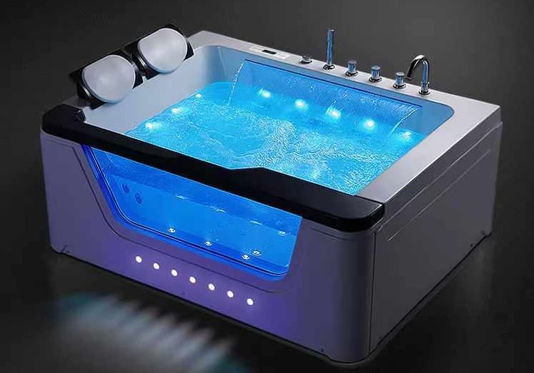 a bathtub with a blue led light and a blue light