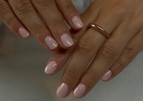 a woman's hands with two rings on them