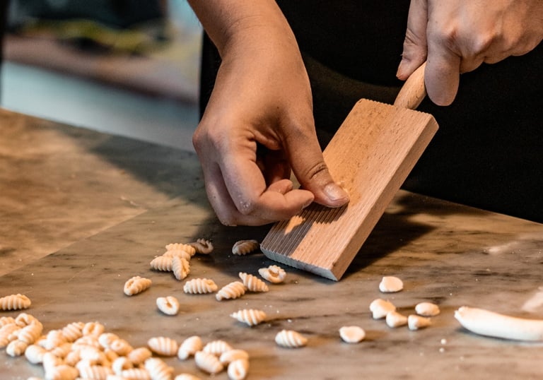 Making Sardinian malloreddus pasta during a cooking class in Sardinia.