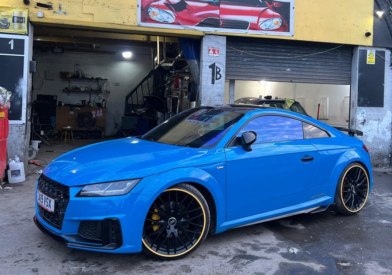Expertly painted blue car with custom wheels at MKMotors garage in NW2