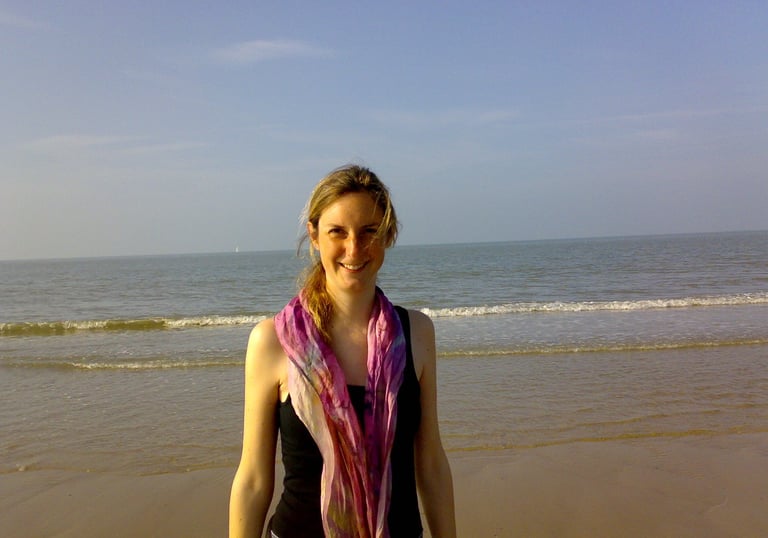Friendly smiling woman at the beach