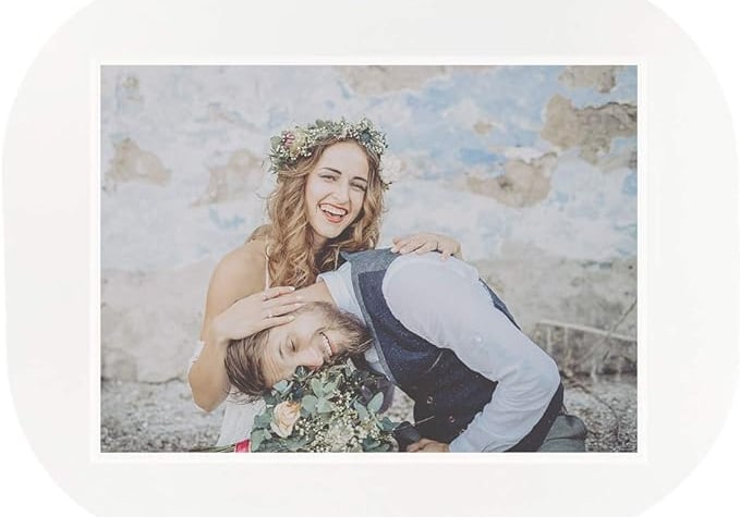 a bride and groom posing for a photo