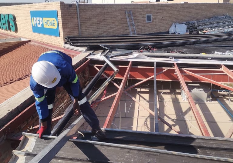 Environmental Pro Construction team replacing a roof structure on a commercial building in West Rand