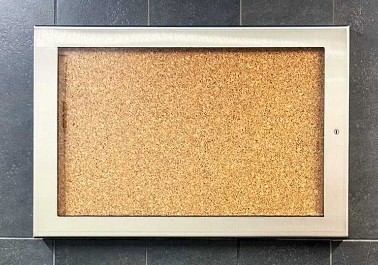 memo board mounted in tile wall