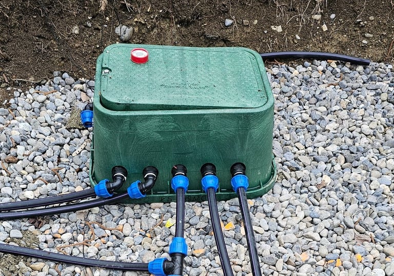 solenoid valve manhole with gravel bottom and outlet pipes