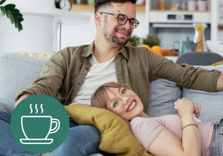 a man and woman sitting on a couch