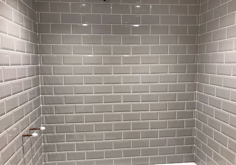 bathroom wall in malvern tiled by Lakes building and plastering services