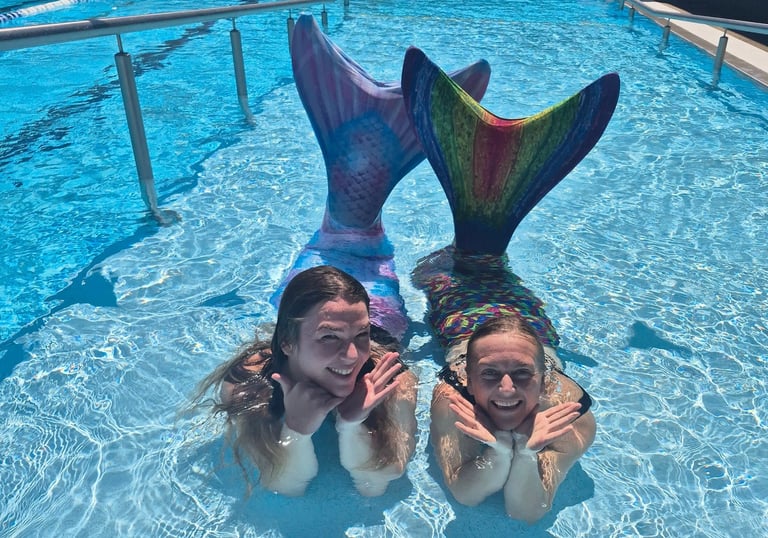 Adult Mermaids in a pool