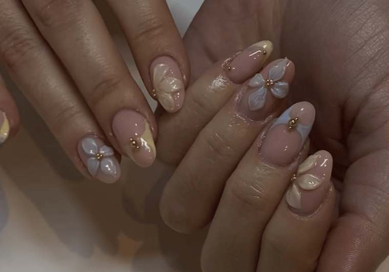 a woman's hands with a manicured manicured manicured nails