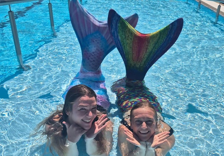 Adult Mermaids in a pool