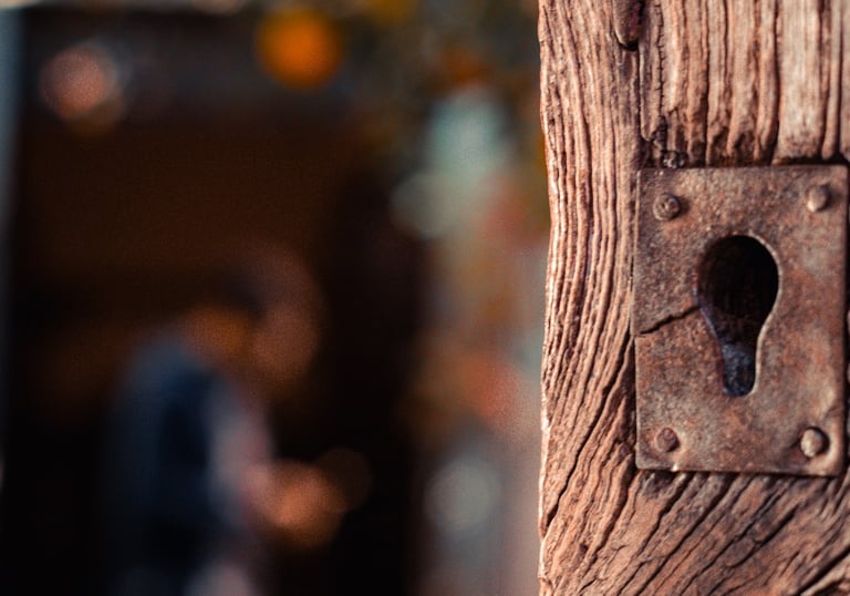 Detail of an old wooden door lock in Sardinia.