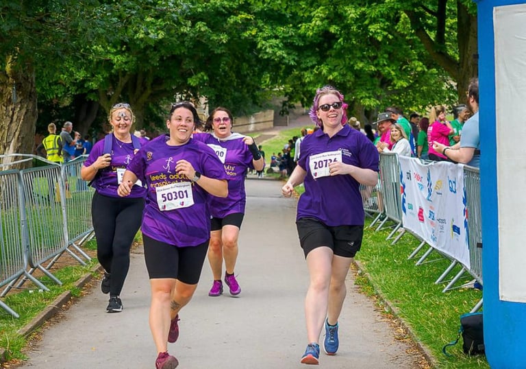 Team members running at the donor run