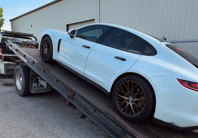 Porsche on CarGo flat bed tow truck Houston, TX