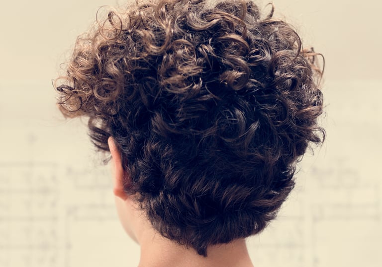 Beautiful curly hair after perm treatment - Women's perm at Just Teasin Brookfield