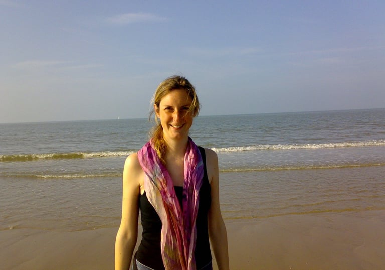 Friendly smiling womam at the beach