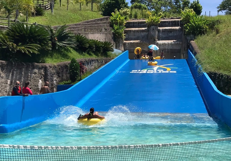 a person on a surfboard in a pool