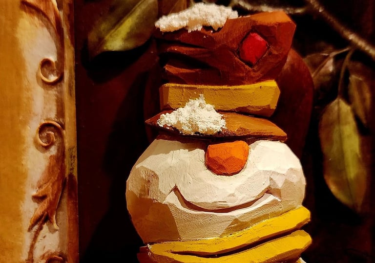 hand carved snowman with tophate and scarf, carved in basswood by James Smith