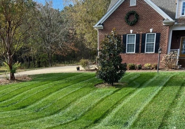Expert lawn service maintaining a clean, healthy, and well-managed residential yard.
