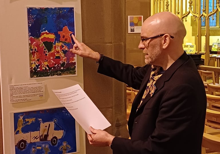 Poetry reading at Liverpool church showcasing paintings created by kids in the Ukrainian war