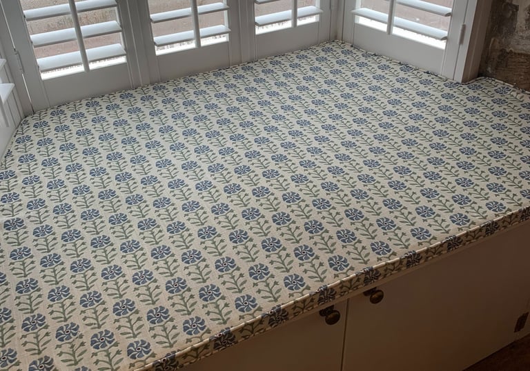 A bespoke window seat cushion shaped to fit an awkward space.