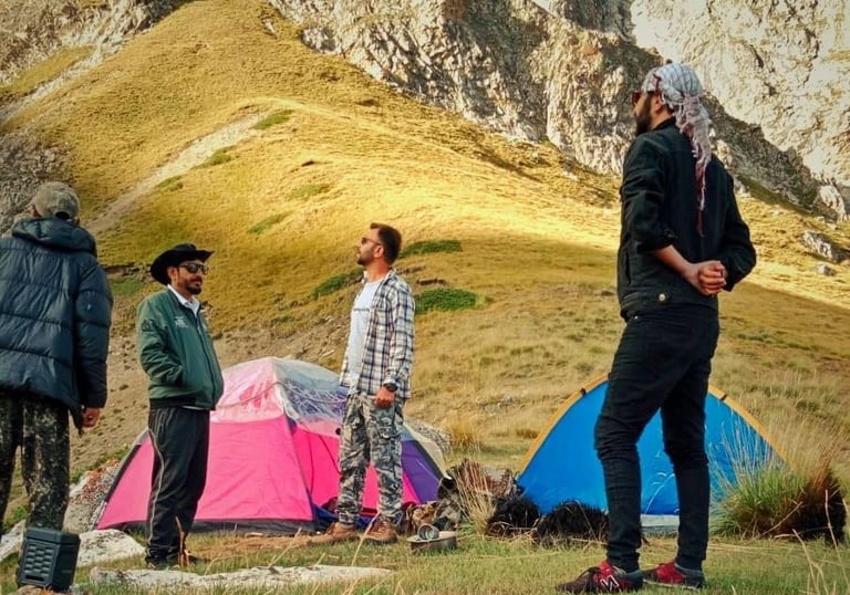 Tents set up on Khyber Sar Mountain with panoramic views of the Hunza Valley camping
