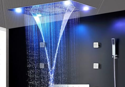 a shower head with a blue light shining down