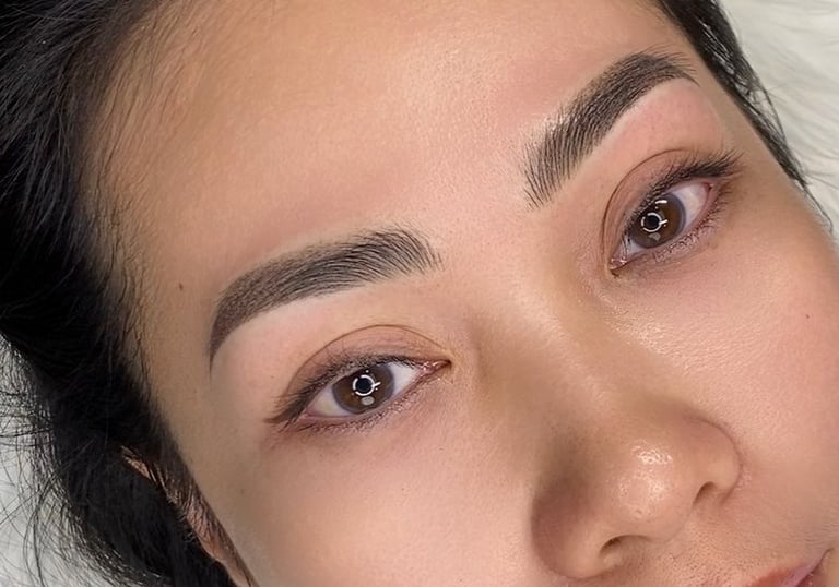 Beautifully healed combo brows showing the blend of hair strokes and soft powder shading.