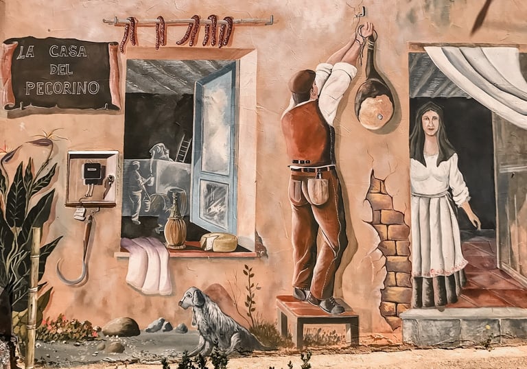Mural in Tortolì, Sardinia, depicting daily life scene with shepherd and woman