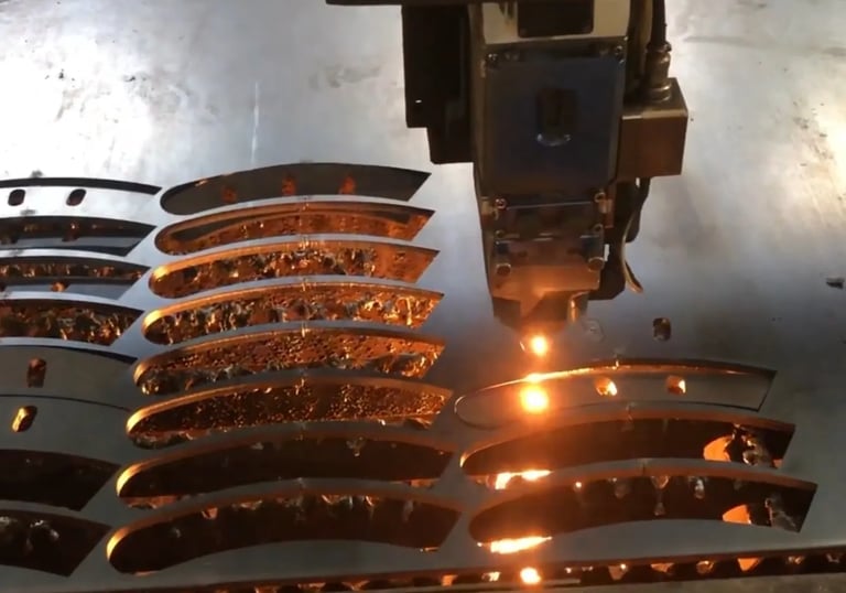 Laser cutting process used to fabricate precision components for strength machines