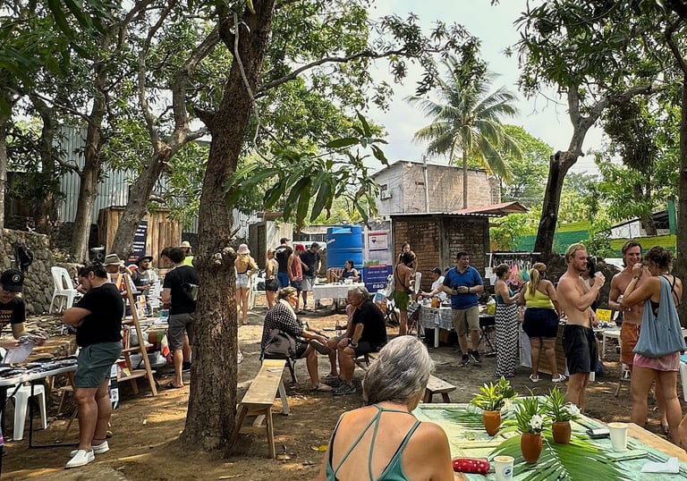 farmers market event with people standing and talking