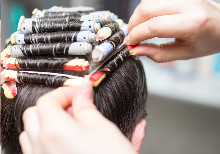 Stylist creating men's curly perm - Men's hair perm at Just Teasin Brookfield