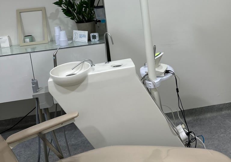 a dental room with a chair and a chair